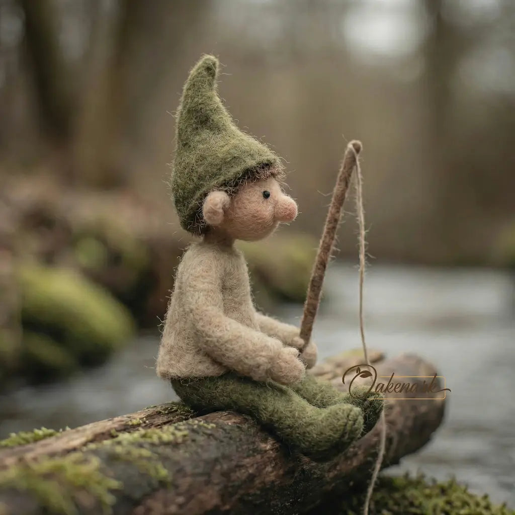 Felted gnome sitting on a log in a forest setting
