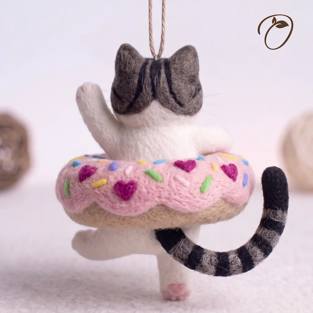 Back view of Donut Drifter Cat felt ornament with striped tail and pink donut