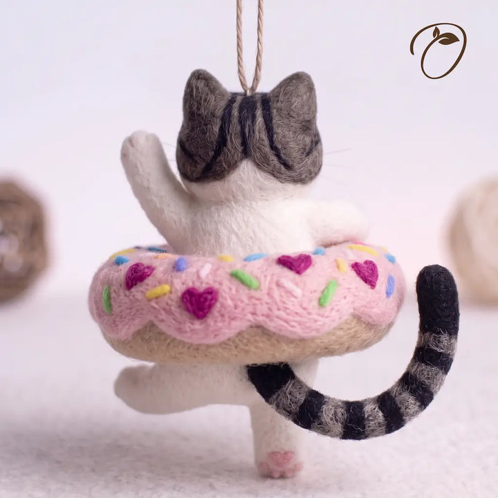 Back view of Donut Drifter Cat felt ornament with striped tail and pink donut