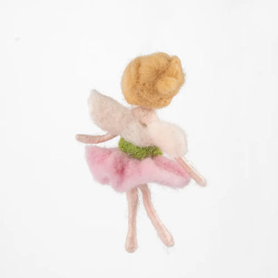 Small fairy doll with a pink dress and green headband on a white background