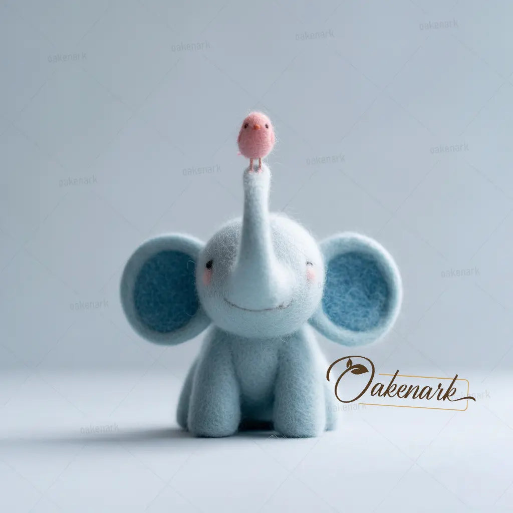 Plush elephant toy with a pink bird on its trunk against a light gray background, featuring the brand 'Oakenark'.