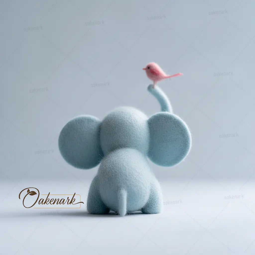 Blue elephant figurine with a pink bird on its trunk against a light gray background, featuring the Oakenark brand.