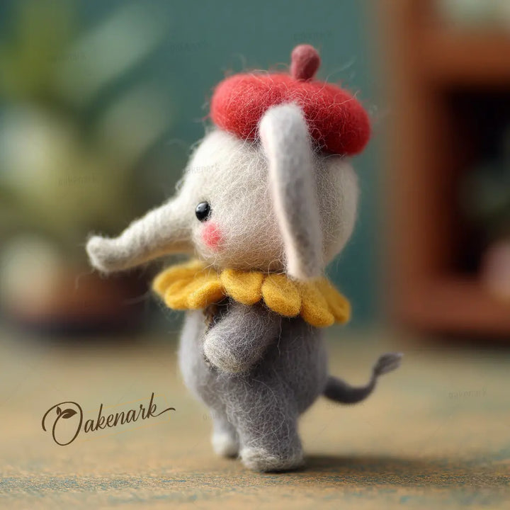 Toy elephant with a red hat and yellow scarf on a blurred background