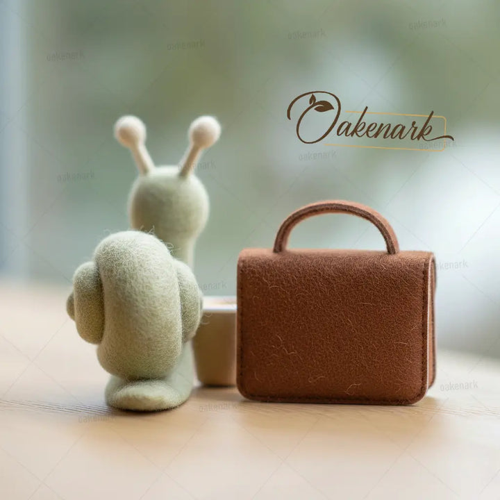 Felted snail, cup, and briefcase with &