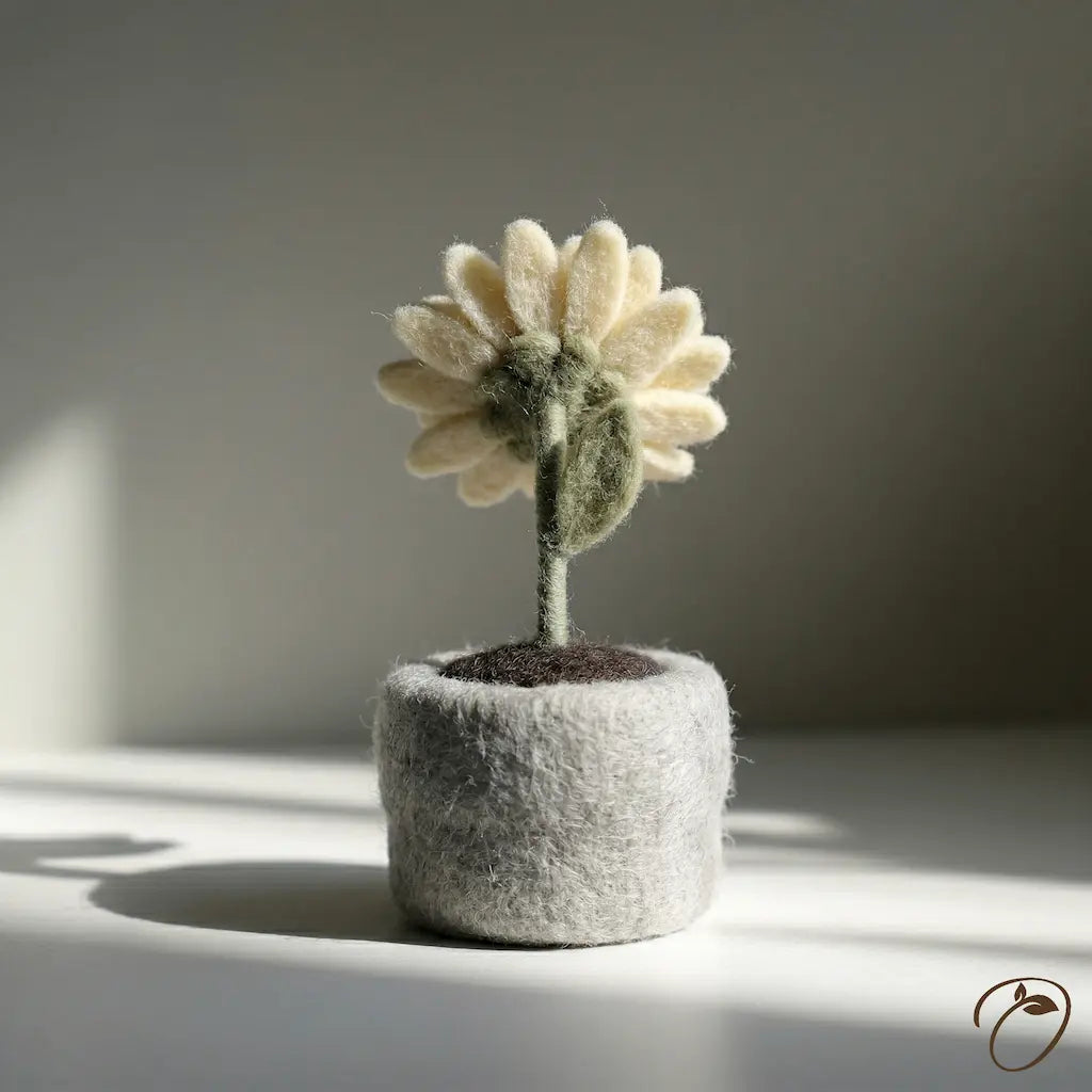 Felted flower in a small pot on a neutral background