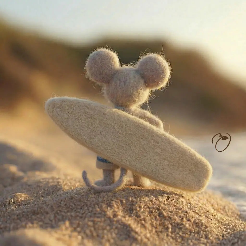 Small mouse-like creature with a surfboard on a sandy beach at sunset.