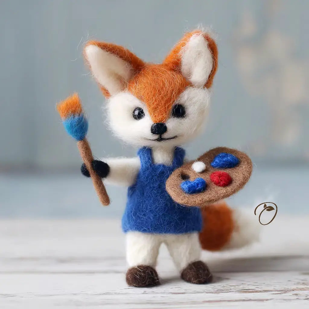 Toy fox in overalls holding a paintbrush and palette on a wooden surface