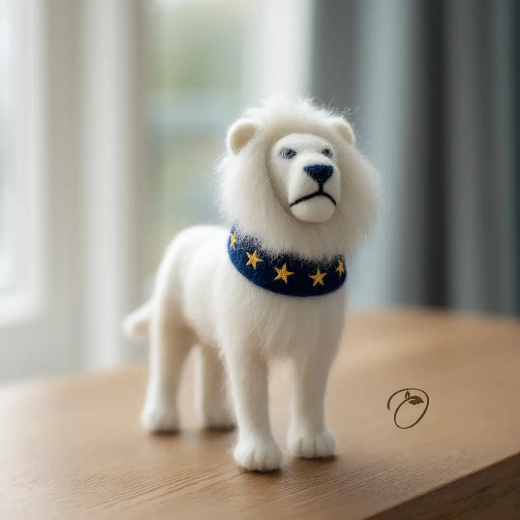 White lion figurine with a blue collar featuring yellow stars on a wooden surface.