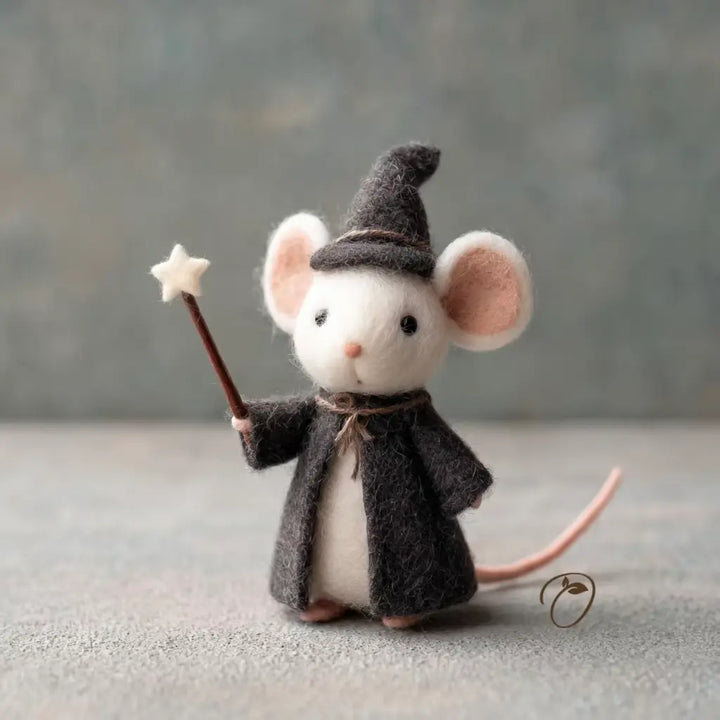 Felted mouse figurine dressed as a wizard with a hat and staff on a neutral background