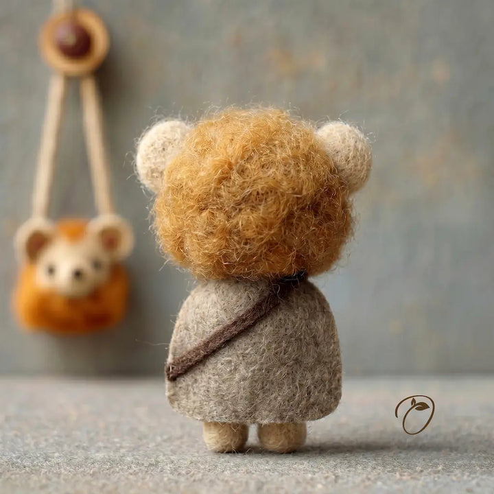 Small teddy bear toy with a backpack on a neutral background