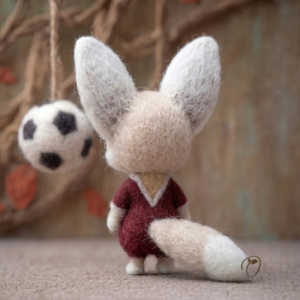 Felted fox figurine with a blurred background