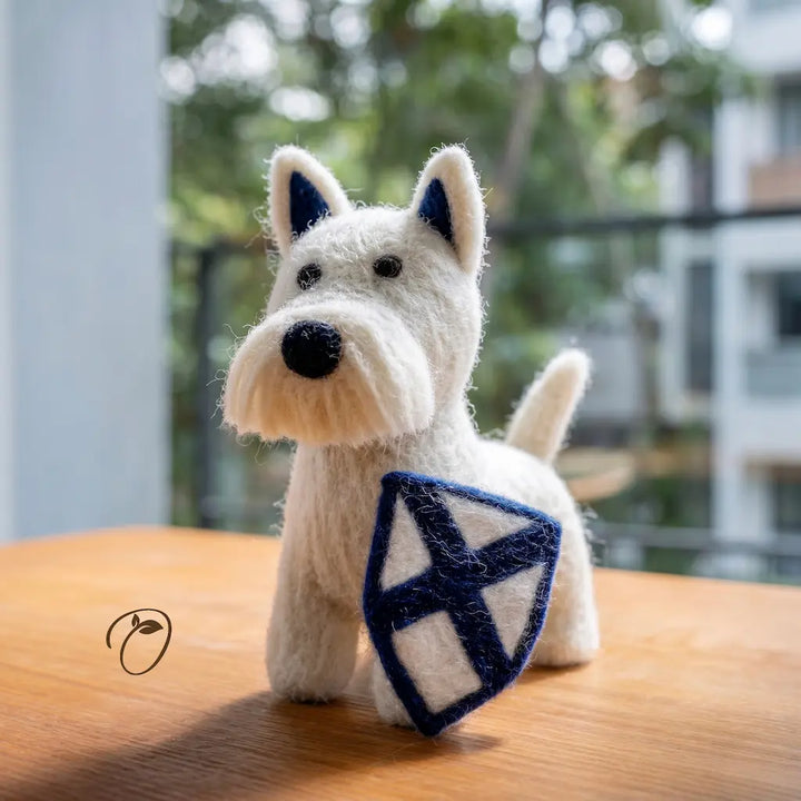 White dog figurine with a blue and white pattern on a wooden surface