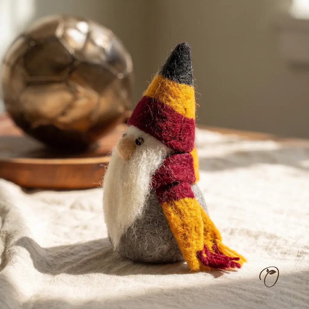 Handmade gnome figurine with a colorful hat on a textured surface