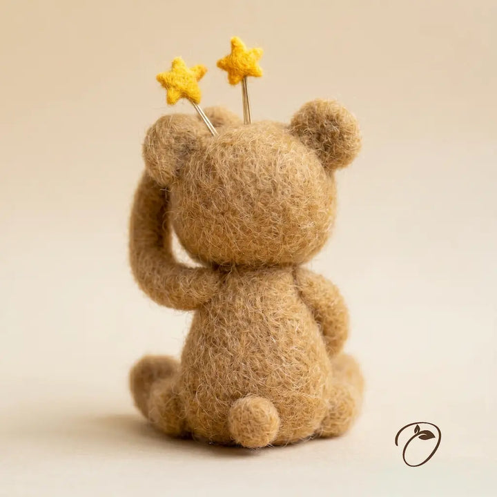 Teddy bear with yellow stars on a beige background
