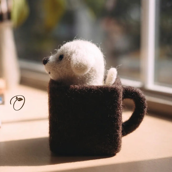Small white bear inside a brown textured mug on a light surface with a blurred background.