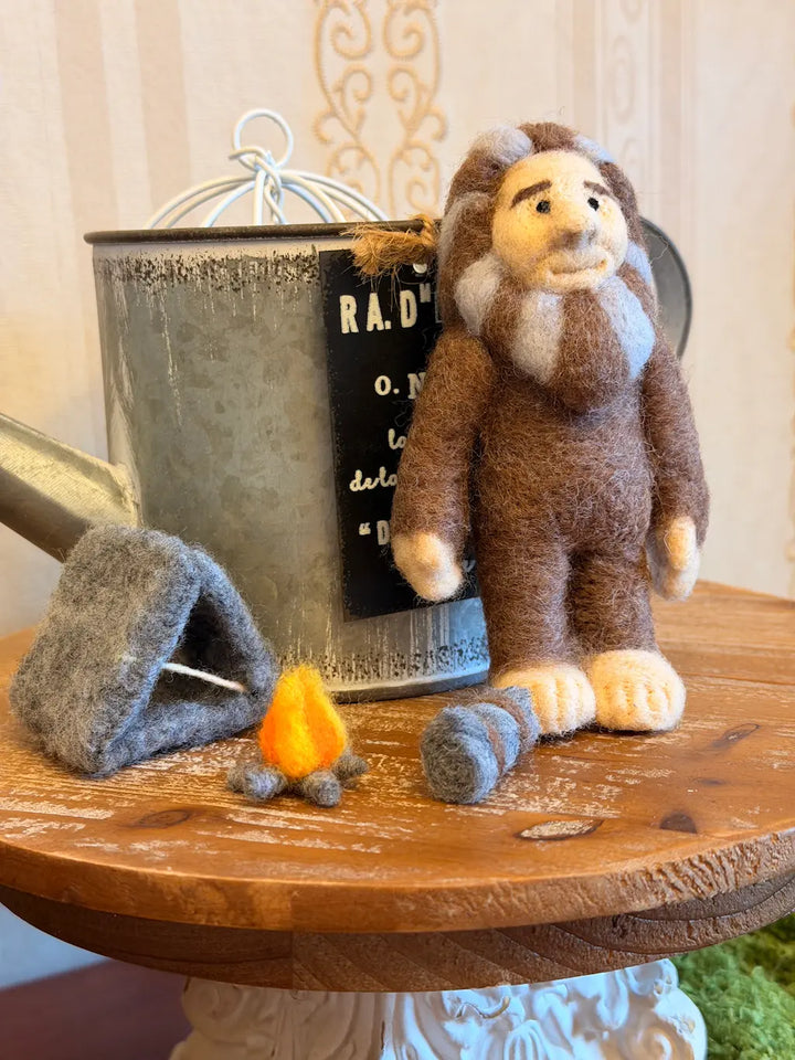 Yeti figurine with a small house.