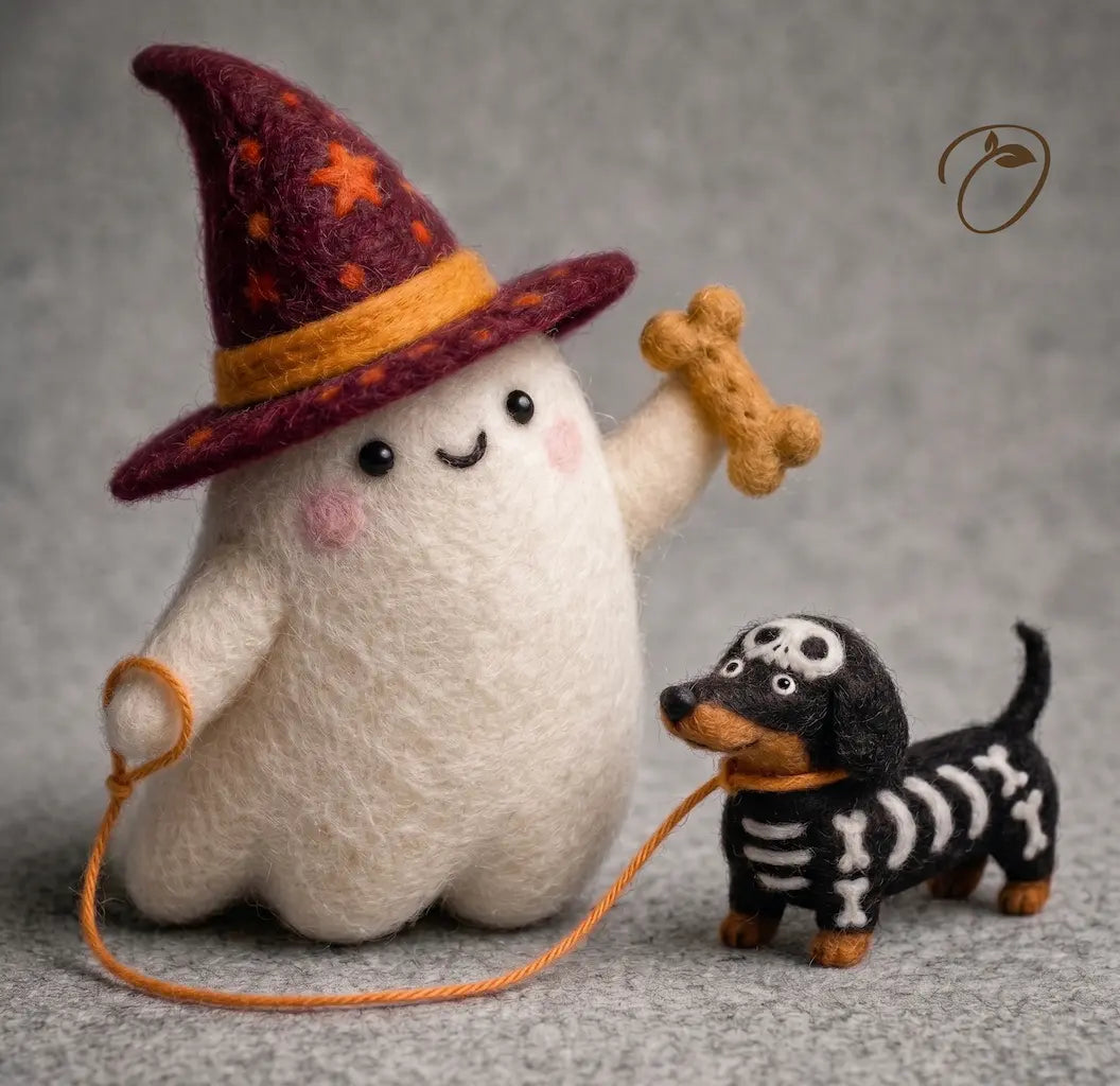 A cute felt art figurine of a white ghost wearing a purple witch hat with orange stars and a yellow band, holding an orange leash and a tan bone, next to a black and white skeleton dachshund on a gray textured background.