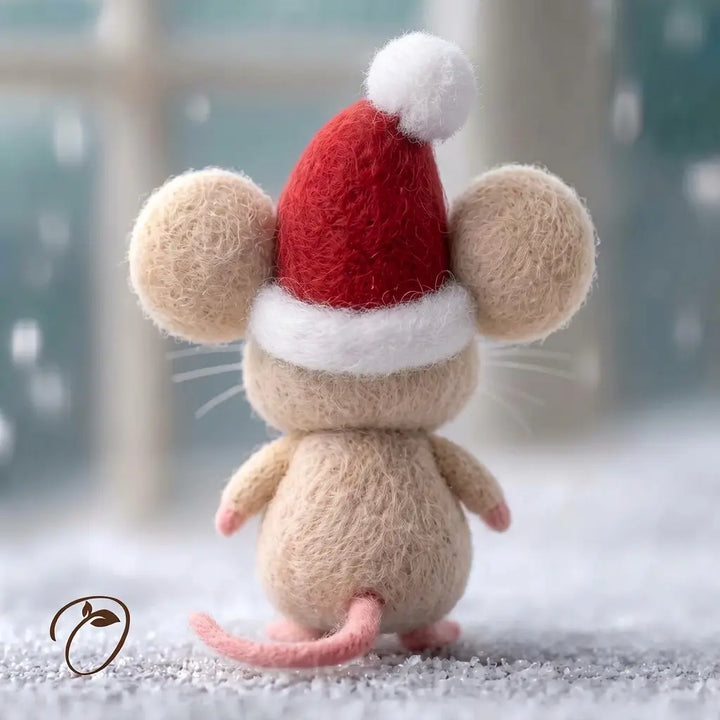 Back view of a wool felt Christmas mouse figurine with a plain red Santa hat, white trim and a curved pink tail