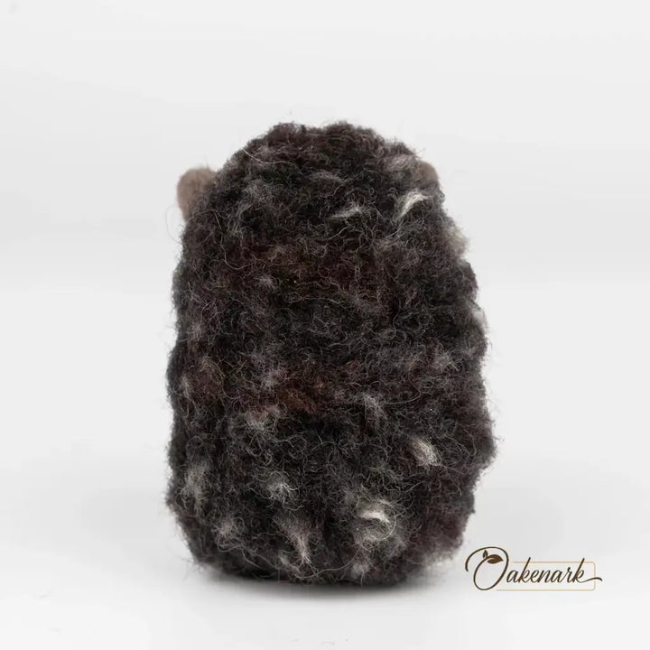 Textured black and gray object on a white background