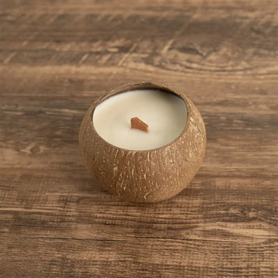 OakenArk Tropical Coconut Scented Candle in a natural, hand-poured coconut shell with a wooden wic