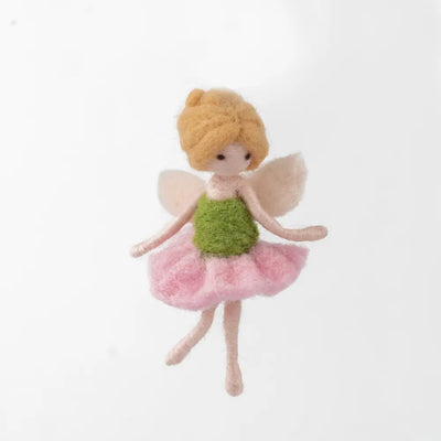 Small fairy doll with a green top and pink skirt on a white background