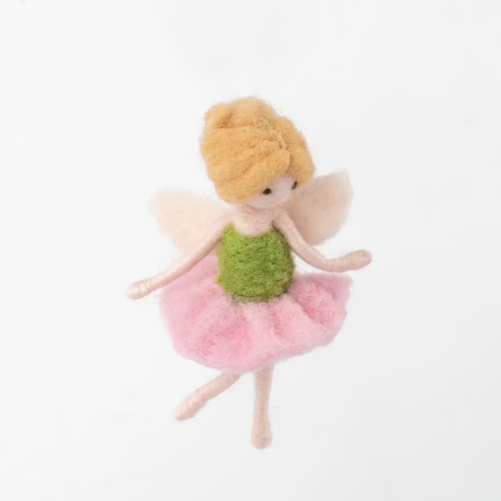Fairy doll with a pink dress and green top on a white background