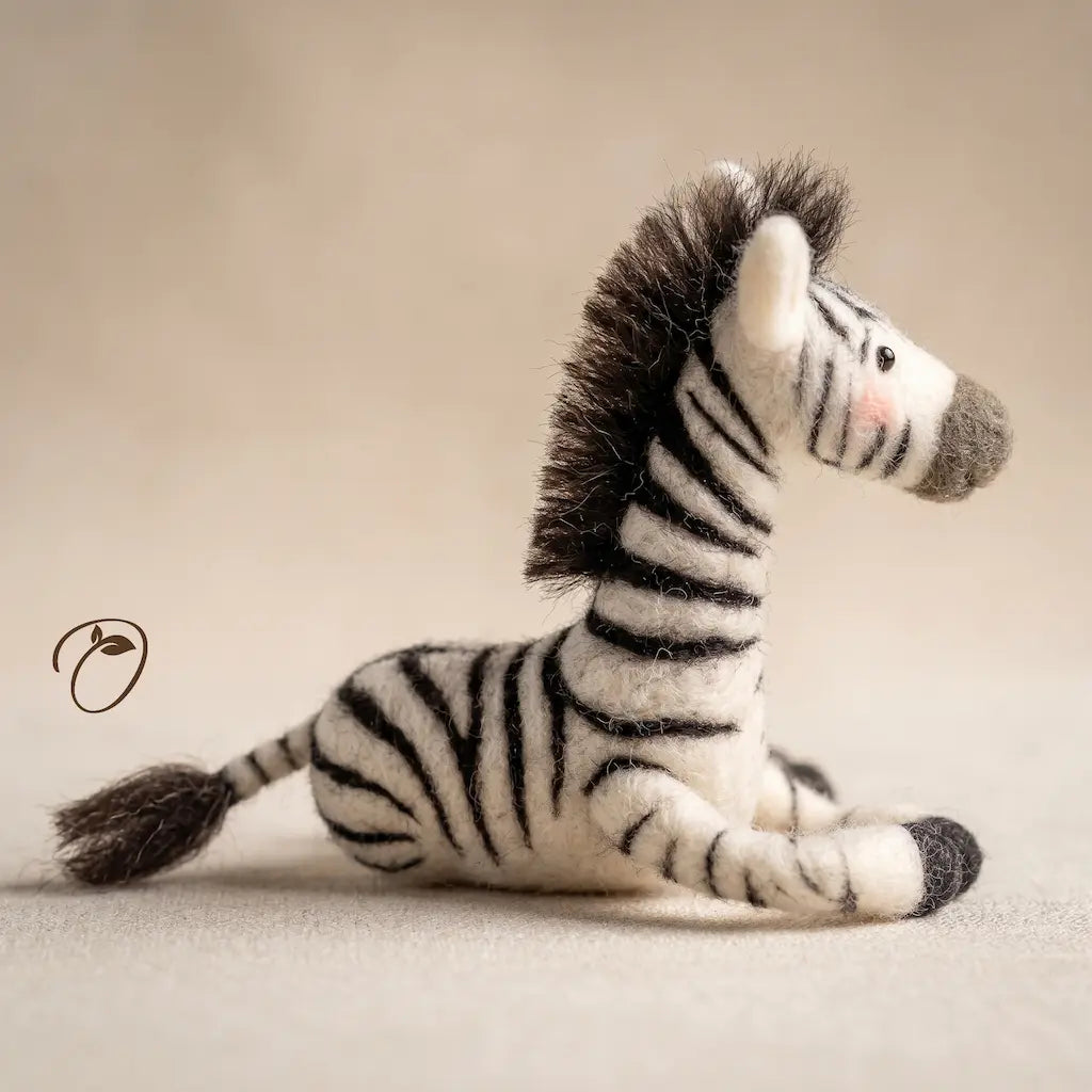 Plush zebra toy on a beige background