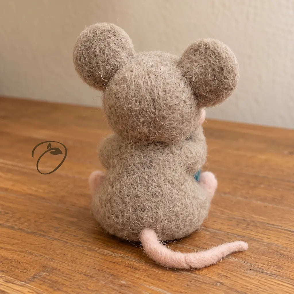 Back view of handcrafted wool felt mouse with long pink tail