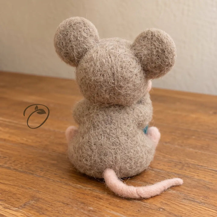 Back view of handcrafted wool felt mouse with long pink tail