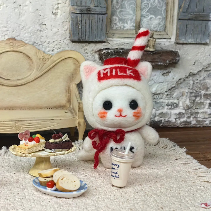 Milk Carton Cat felt figurine with miniature cakes, bread and drink in a cozy cafe display