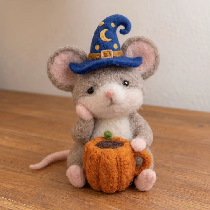 Cozy Cup Mouse wool felt figurine with an orange pumpkin mug and blue star-and-moon wizard hat