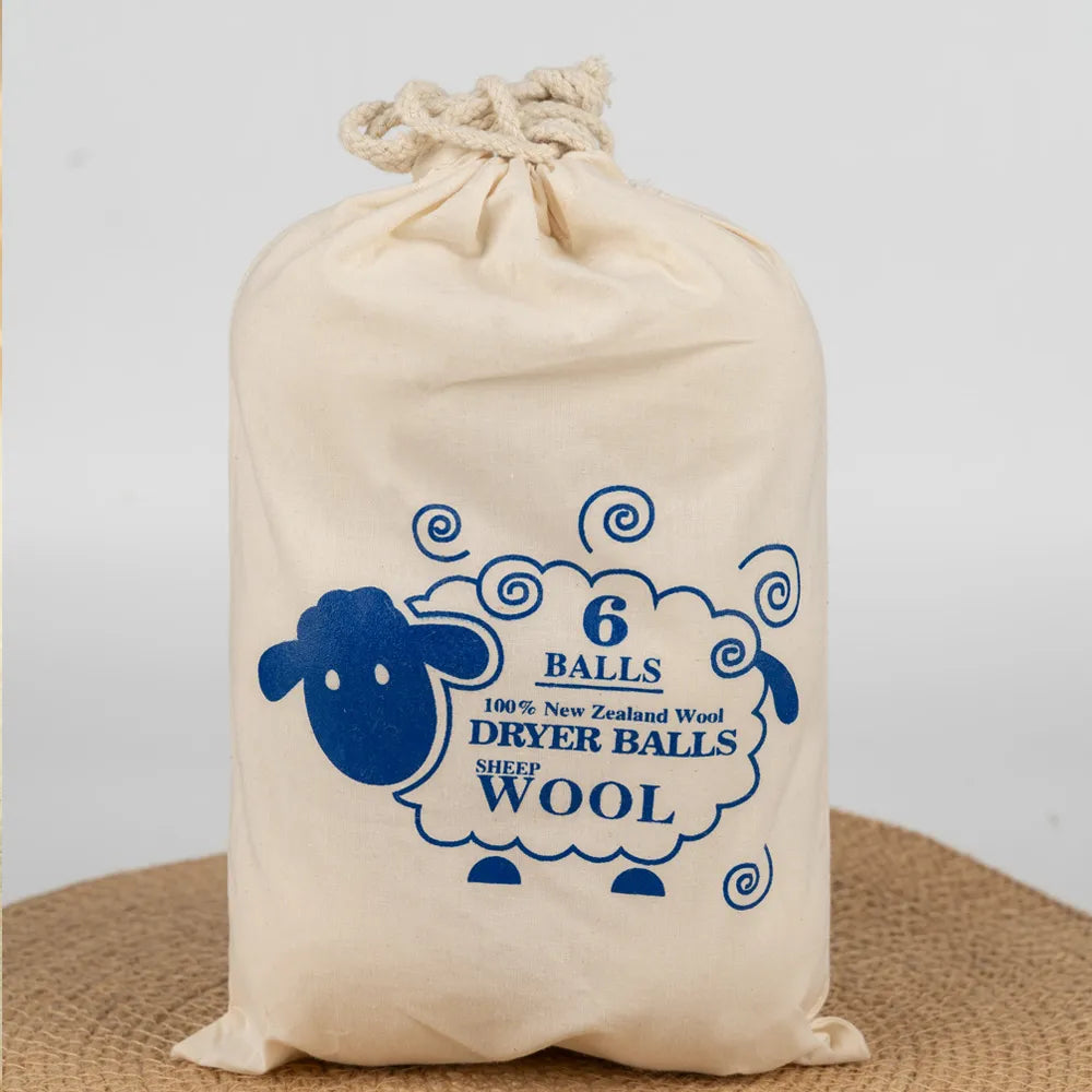 The set of 6 wool dryer balls presented in their beautiful handmade cloth bag, perfect for eco-friendly gifting
