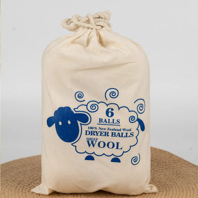 The set of 6 wool dryer balls presented in their beautiful handmade cloth bag, perfect for eco-friendly gifting