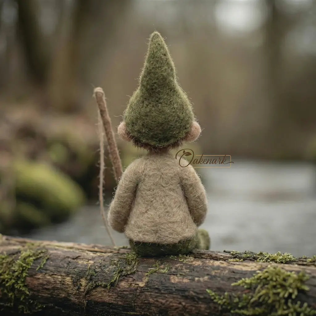 Small gnome figurine with a moss-covered hat sitting on a log in a forest setting.