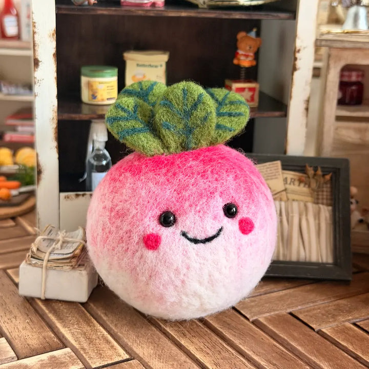 Radish figurine with a smiling face on a wooden surface