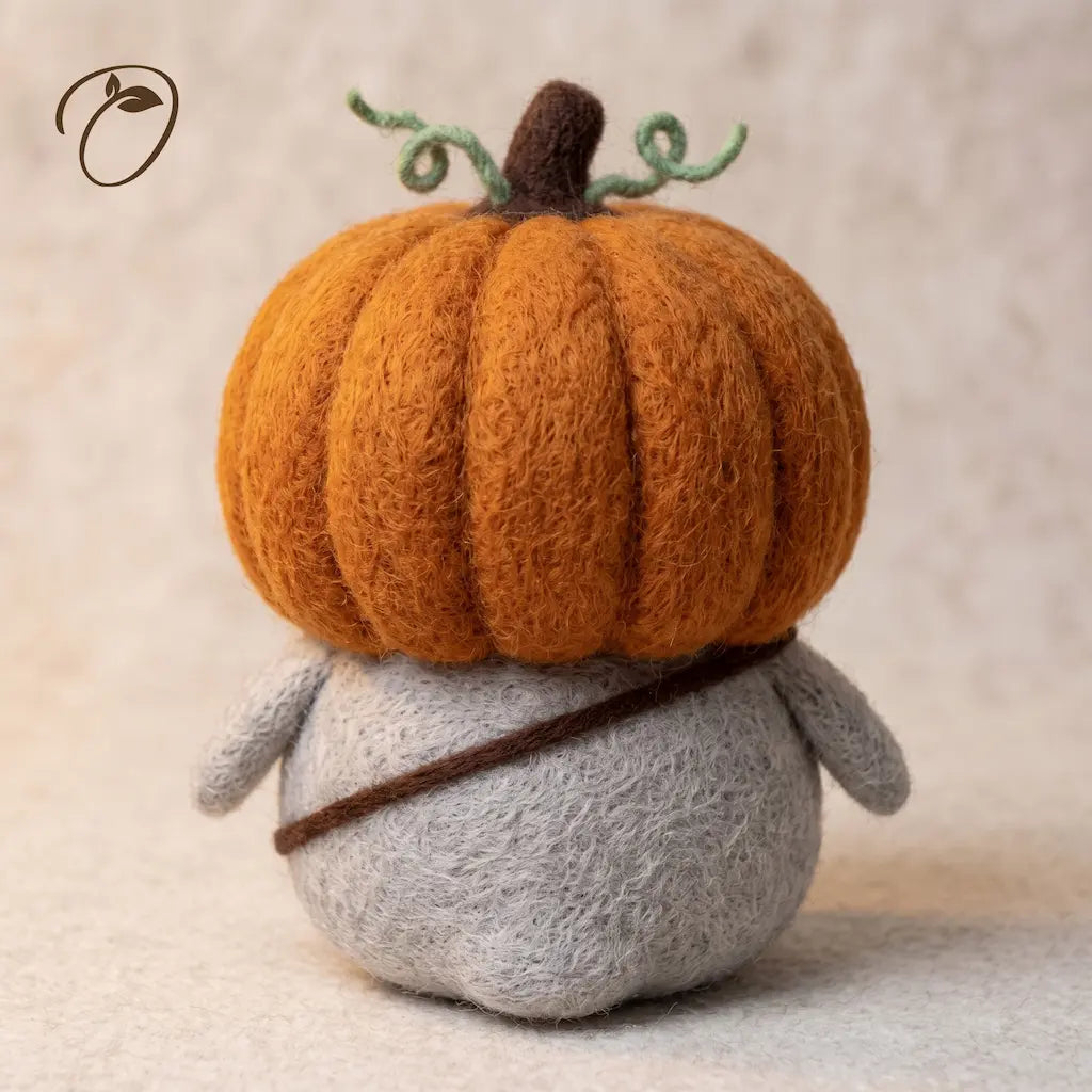 Back view of Pumpkin Rascal Penguin showing orange pumpkin hood, stem and green vines
