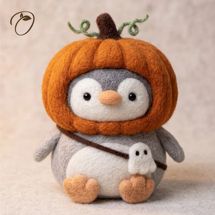 Pumpkin Rascal Penguin wool felt figurine in oversized pumpkin costume with ghost charm