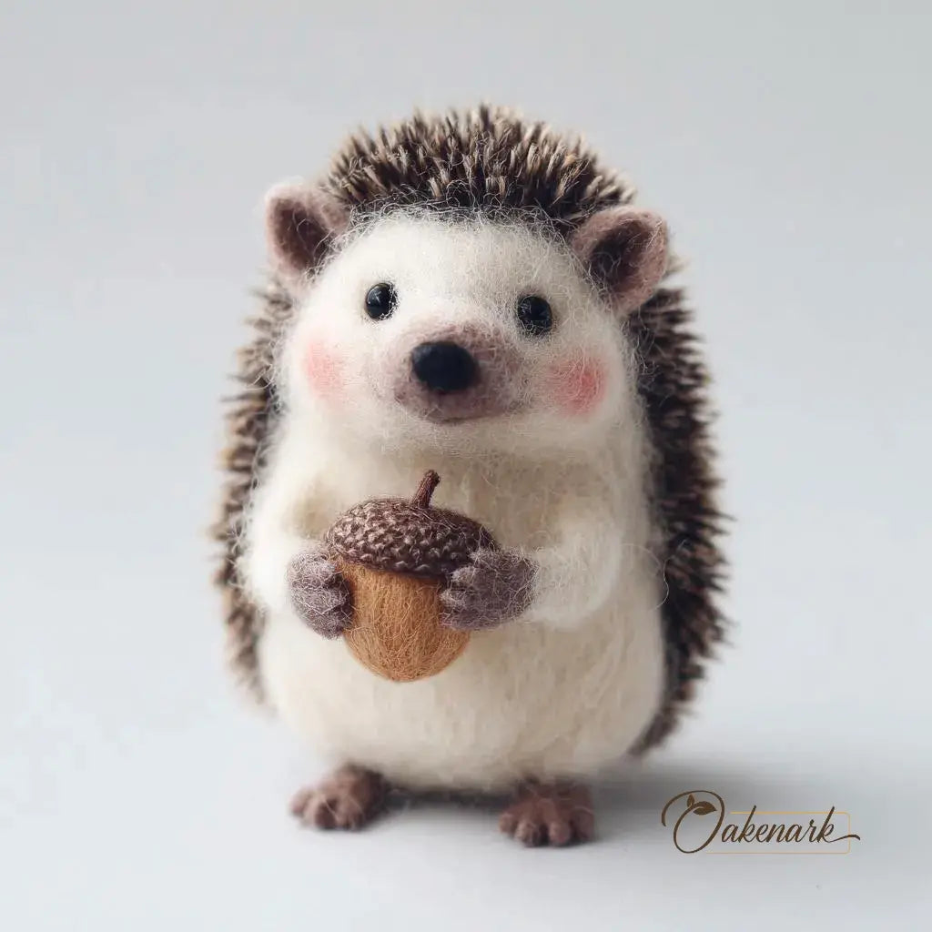 Stuffed hedgehog holding an acorn on a light background