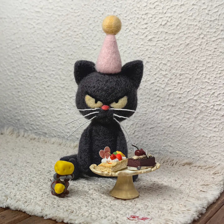 Birthday Mood Cat felt figurine wearing a pink party hat beside miniature cakes and a tiny mouse