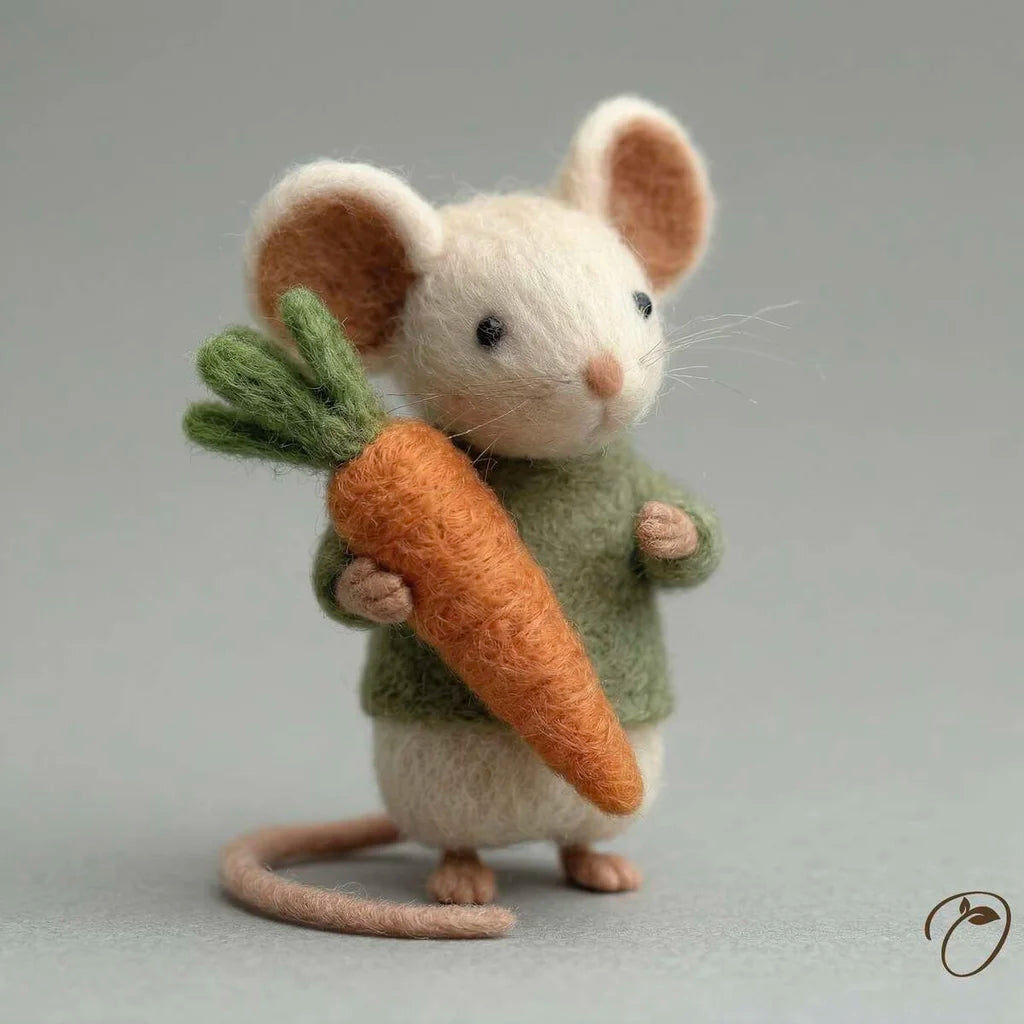 Felted mouse toy holding a carrot against a gray background