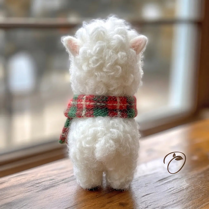 Back view of a handmade fluffy alpaca figurine with red green holiday scarf