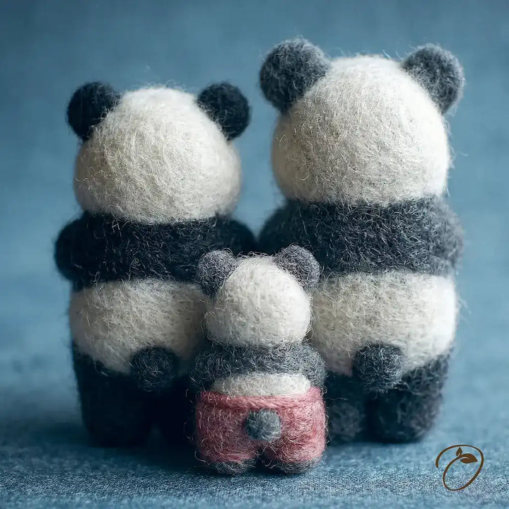 Three panda-shaped toys of different sizes on a blue background