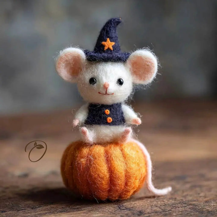 Pumpkin Stargazer mouse wool felt figurine sitting on an orange pumpkin