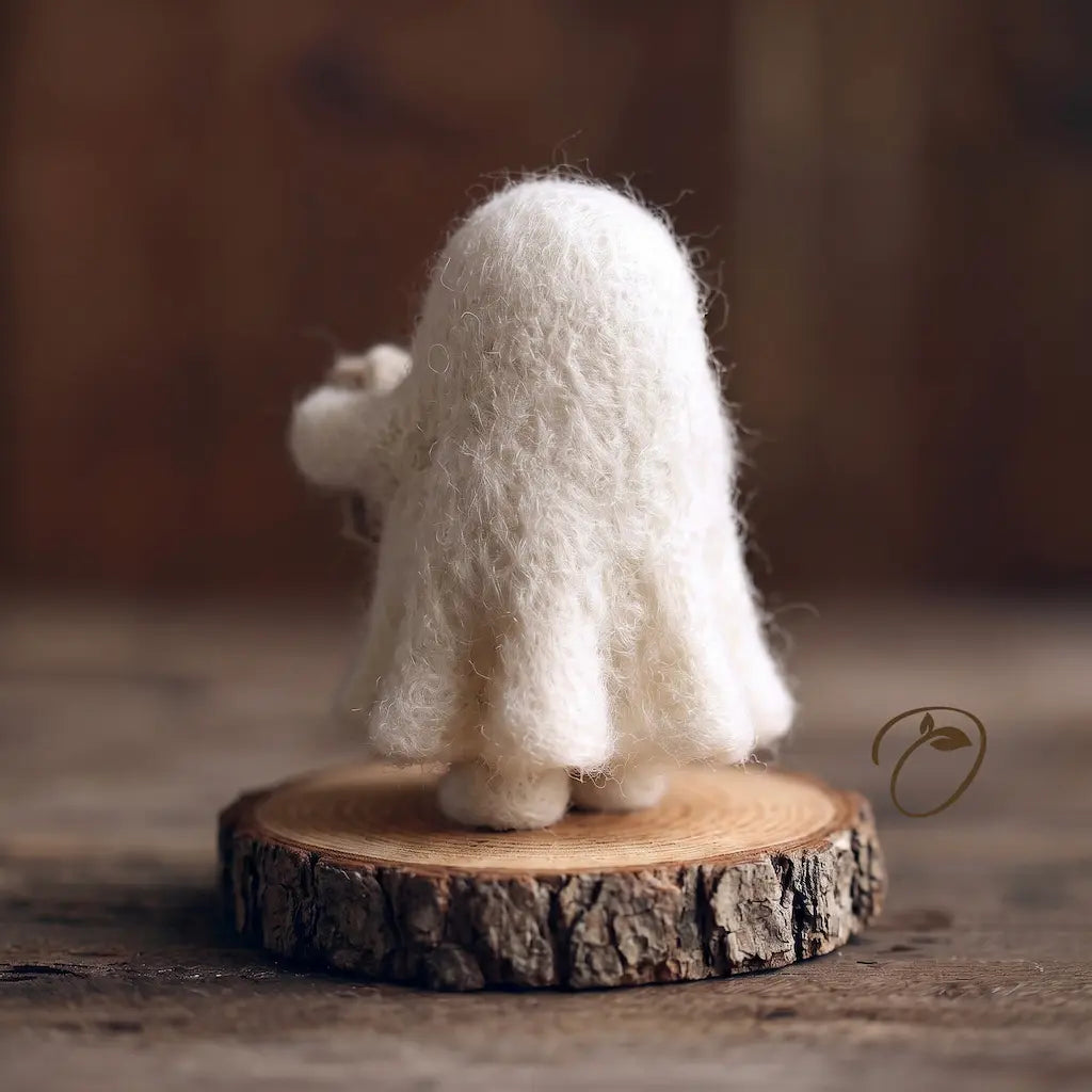 Back view of ivory-white needle-felted ghost figurine