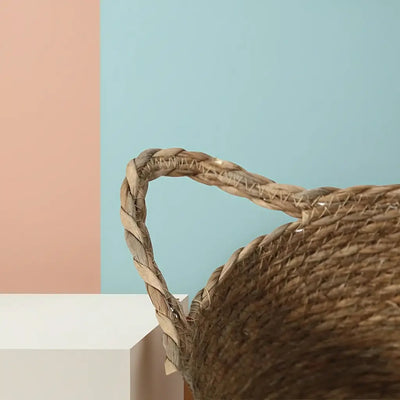 Close up of handwoven Pimajun grass basket handle, natural texture, artisanal craft