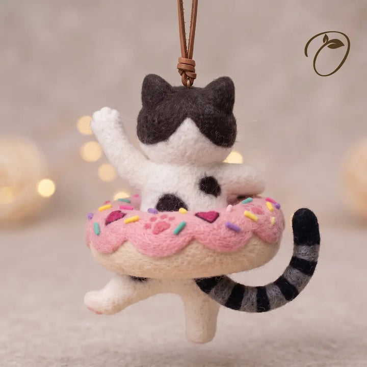 Back view of Donut Drifter Cat felt ornament with striped tail and pink donut