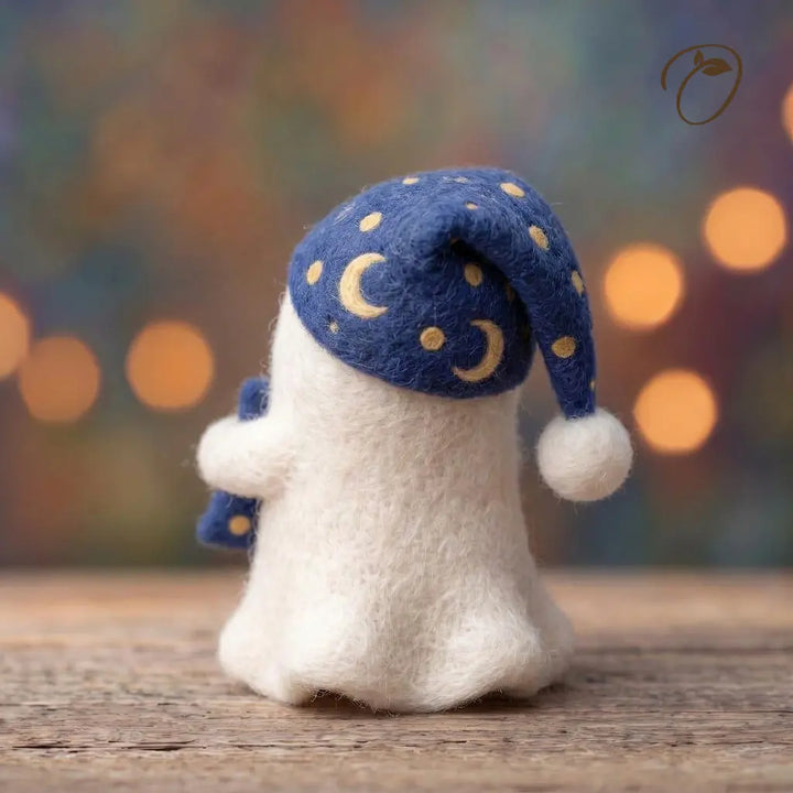 Back view of Moonlit Slumber Ghost felt figurine showing a navy sleep cap with golden crescent moons and dots