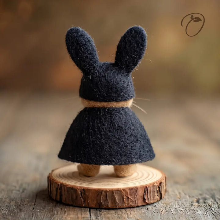 Back view of Masked Bunny felt figurine showing the black cape and upright ears