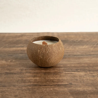 OakenArk Tropical Coconut Scented Candle in a natural, hand-poured coconut shell with a wooden wic