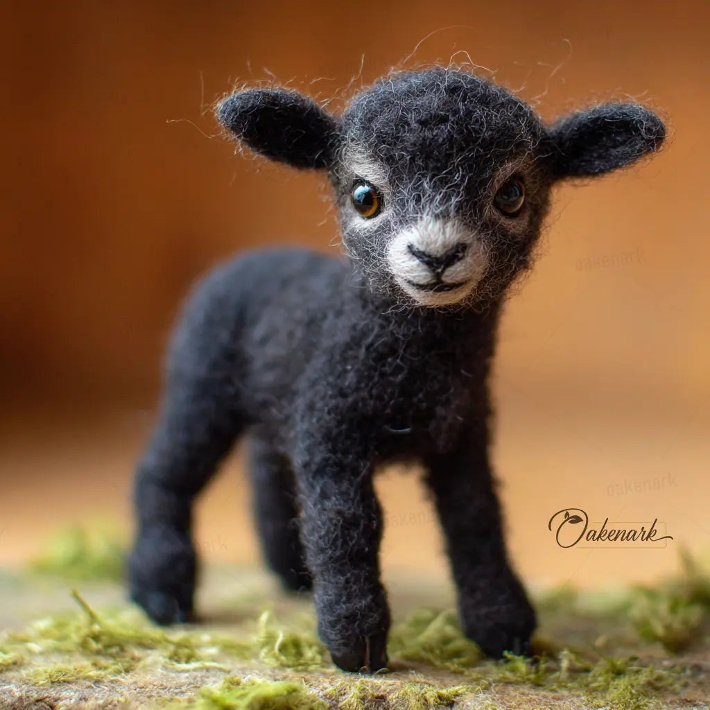 Textured black lamb figurine on a natural background
